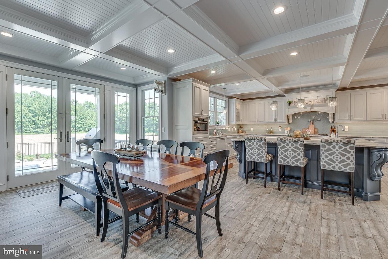South Harrison Residence — open kitchen and dining under coffered ceilings