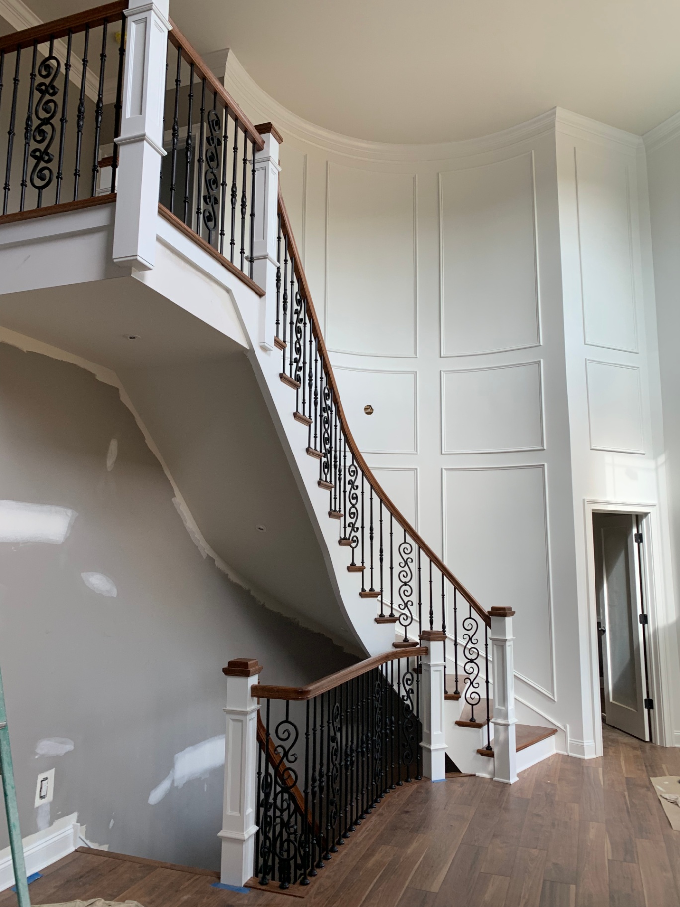 Mullica Hill Residence — curved stair and paneled wall