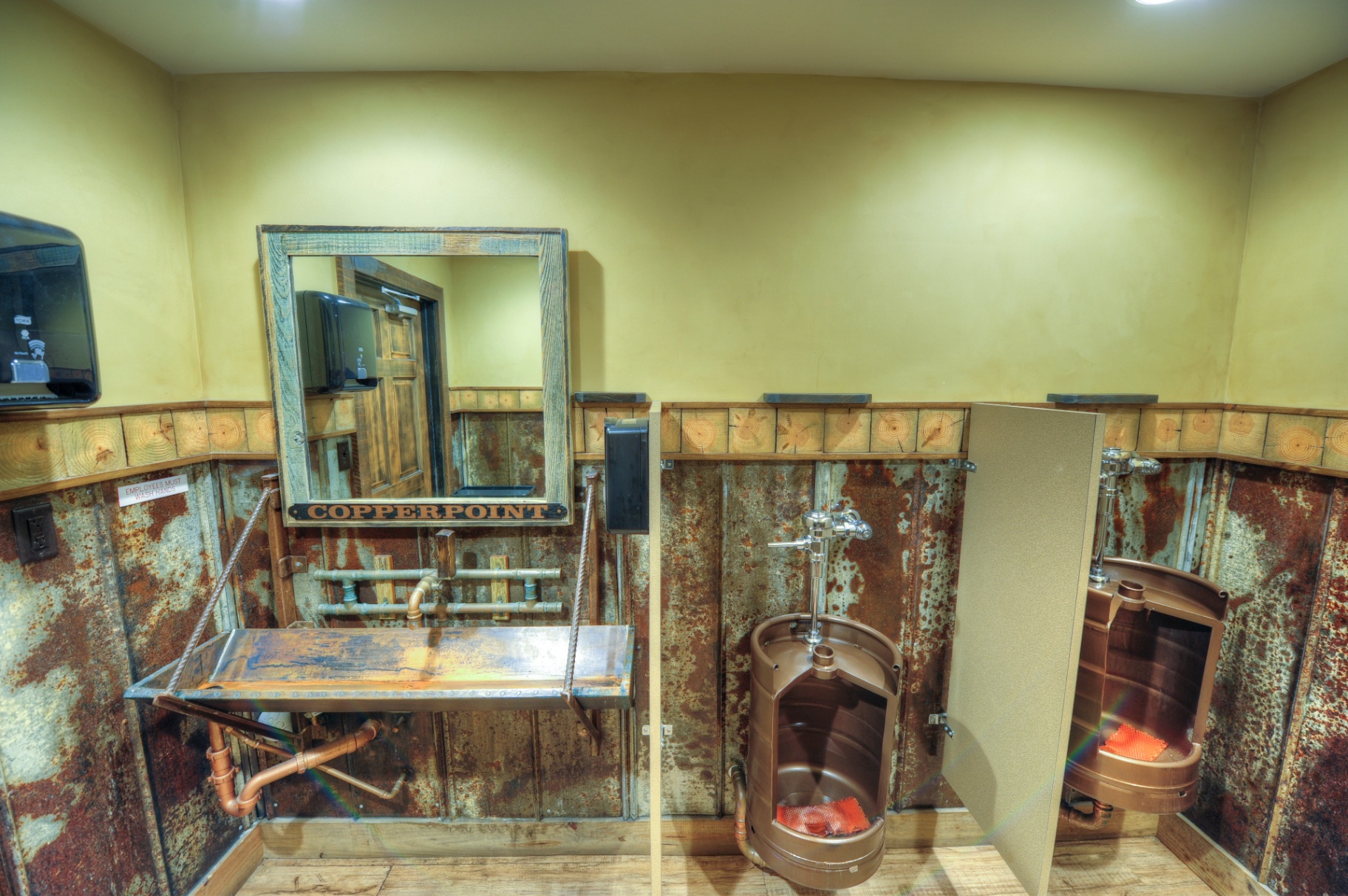 Copperpoint Brewing Company, Boynton Beach FL — restroom with keg fixtures and salvaged metal