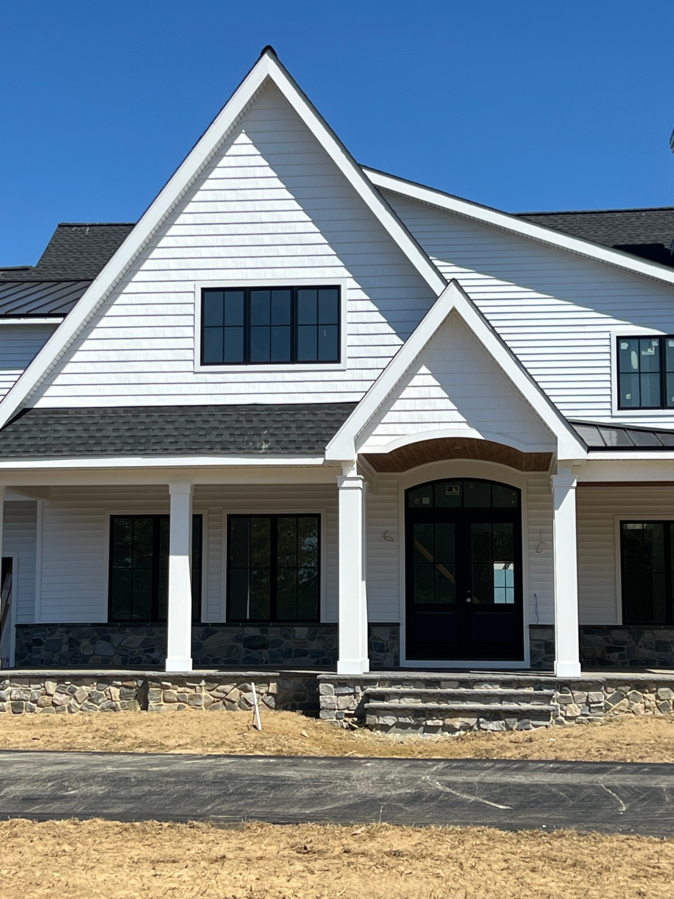 Woodstown Residence II — entry porch and arched front door