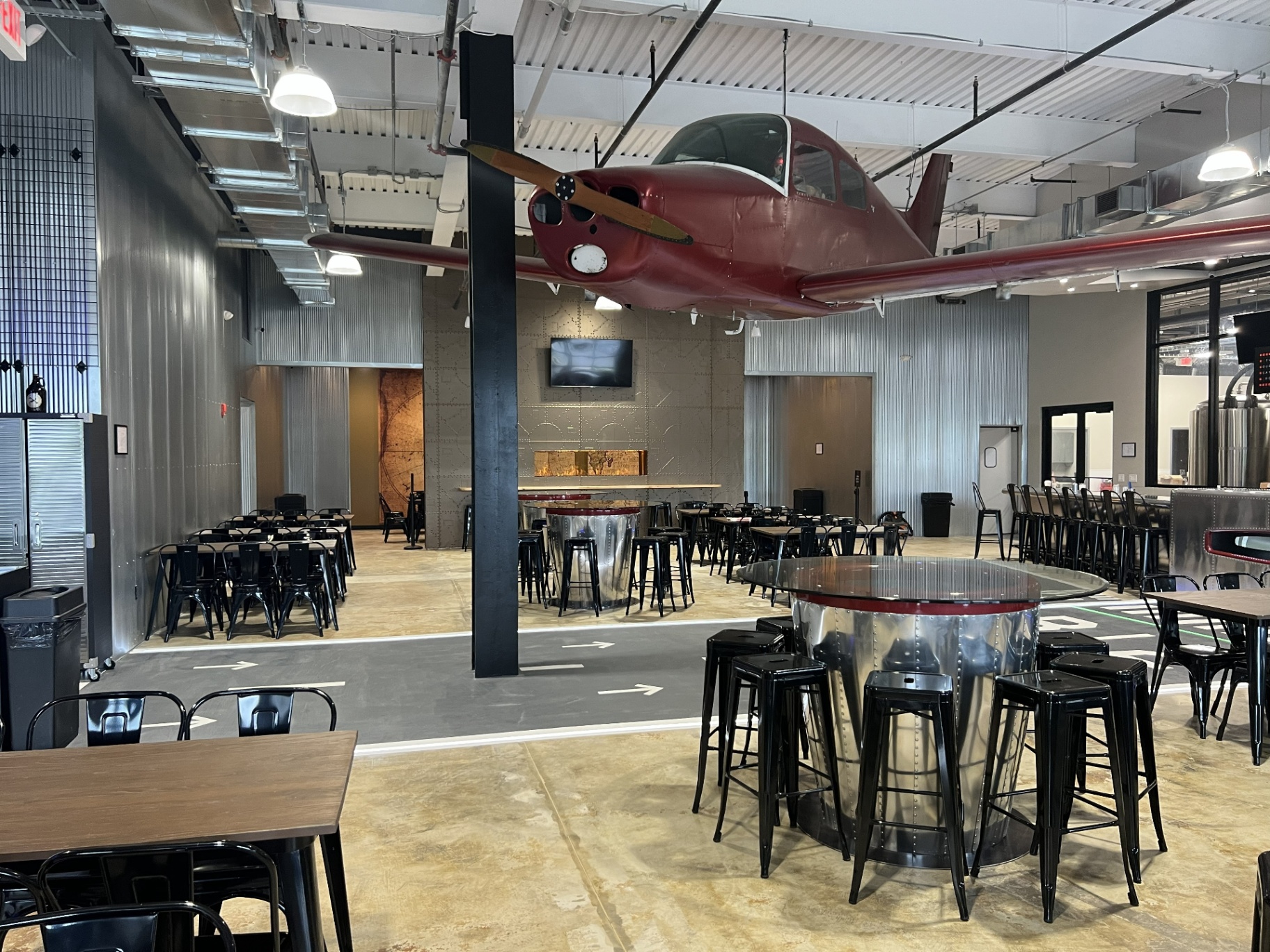 Bonesaw Brewing Deptford — hangar-style dining hall with corrugated metal walls