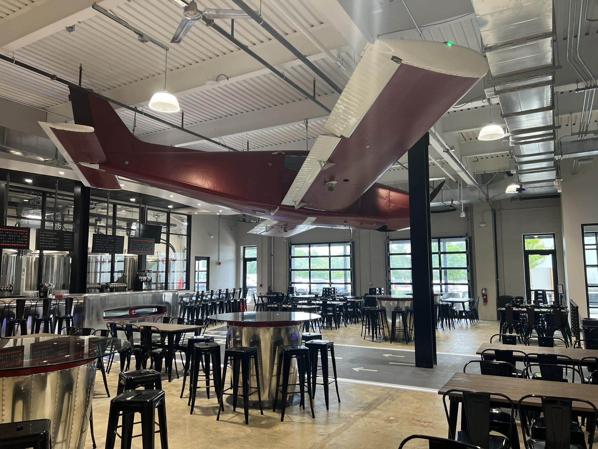 Bonesaw Brewing Deptford — aircraft tail and wing over the taproom