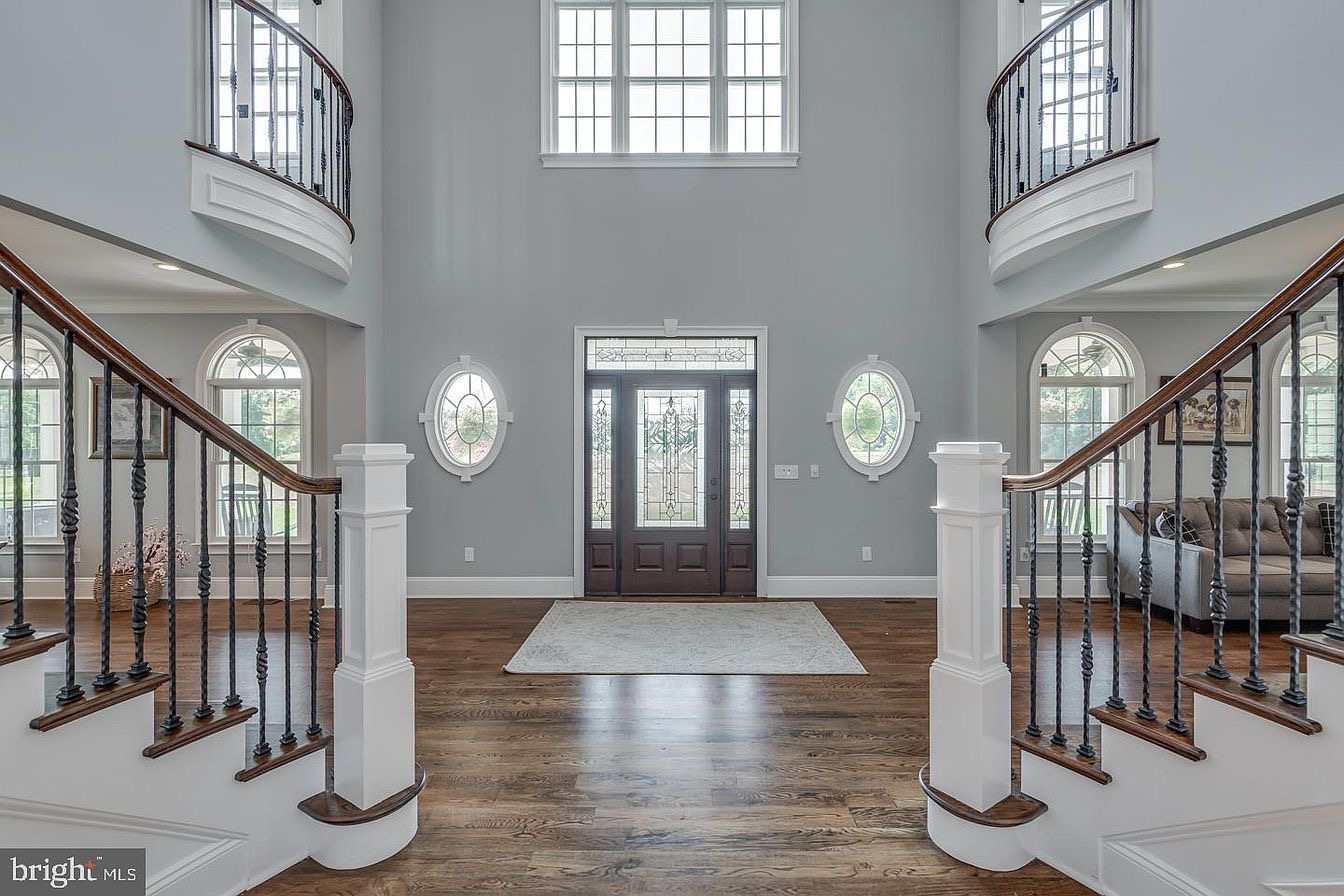 South Harrison Residence — two-story foyer with dual staircases
