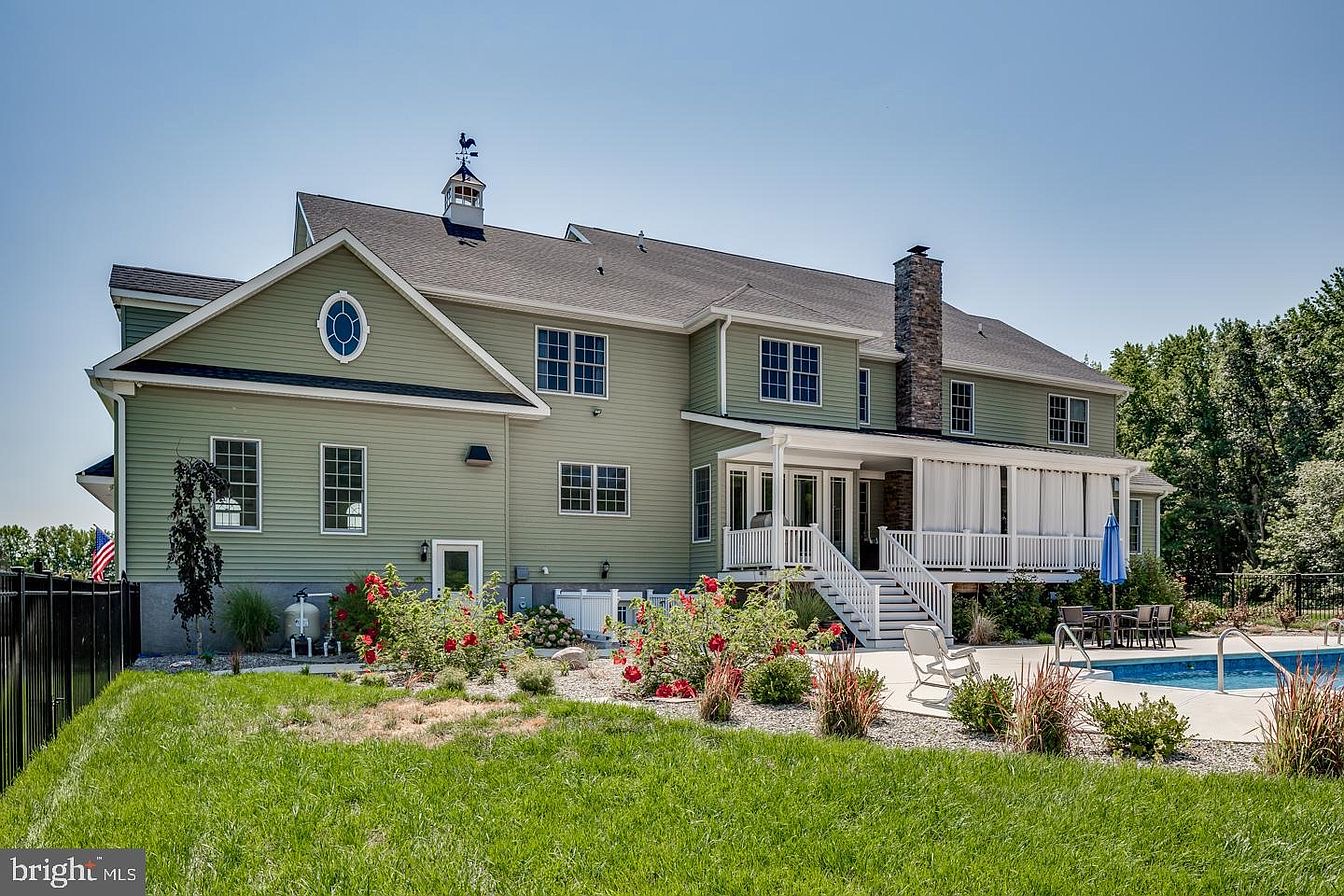 South Harrison Residence — rear elevation with covered porch and pool