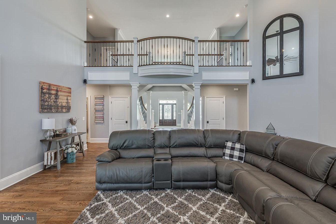 South Harrison Residence — two-story great room with second-floor balcony