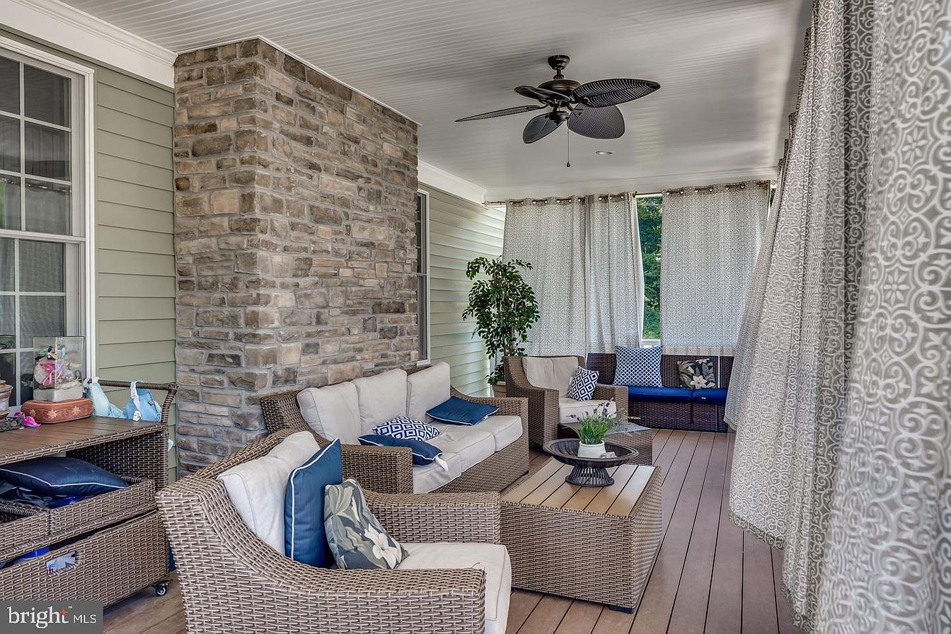 South Harrison Residence — covered rear porch with stone chimney