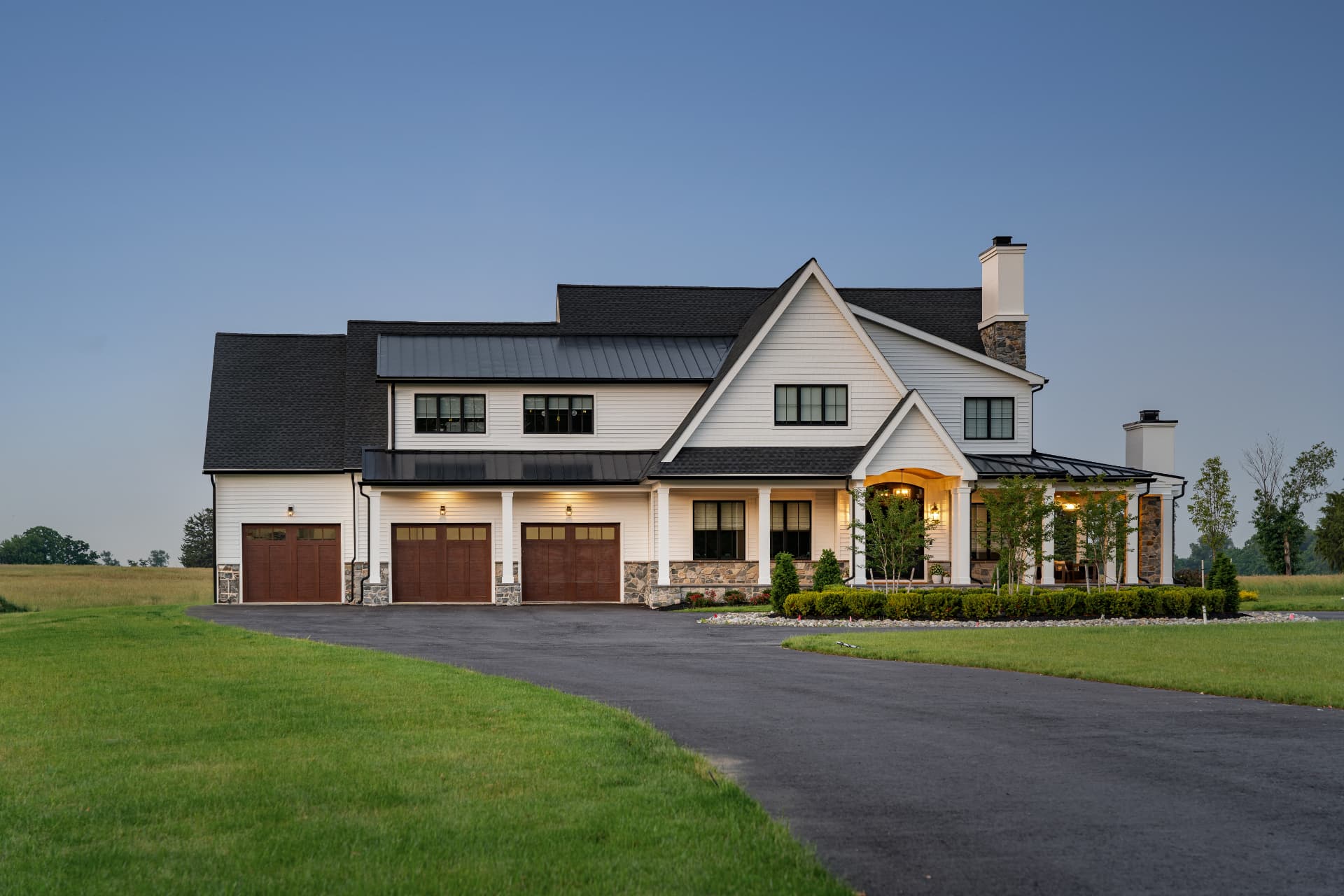 Carr Residence — garage wing and entry porch at dusk