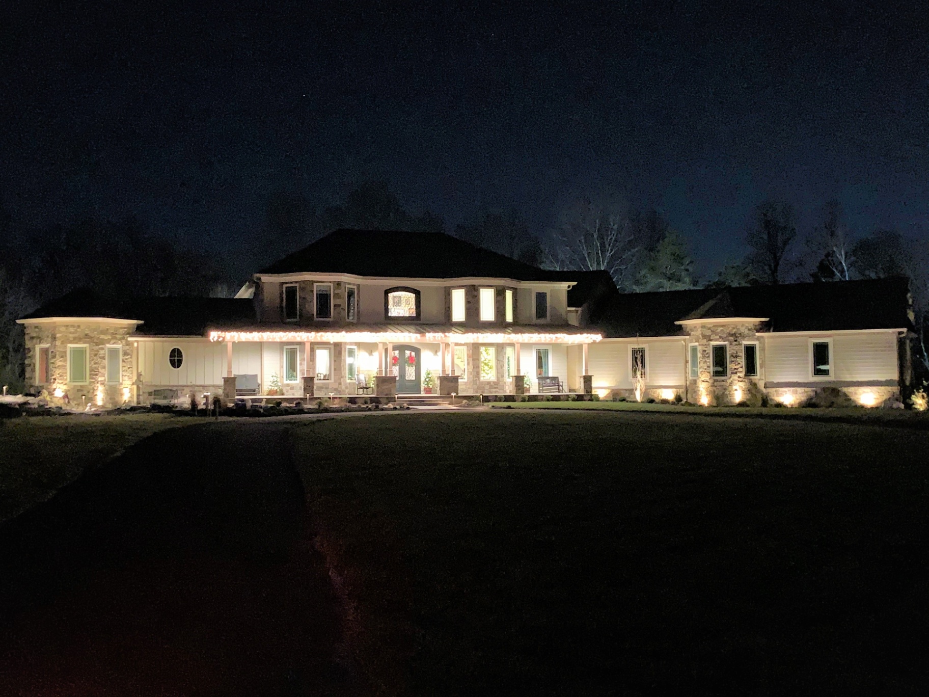Mullica Hill Residence — illuminated front elevation at night