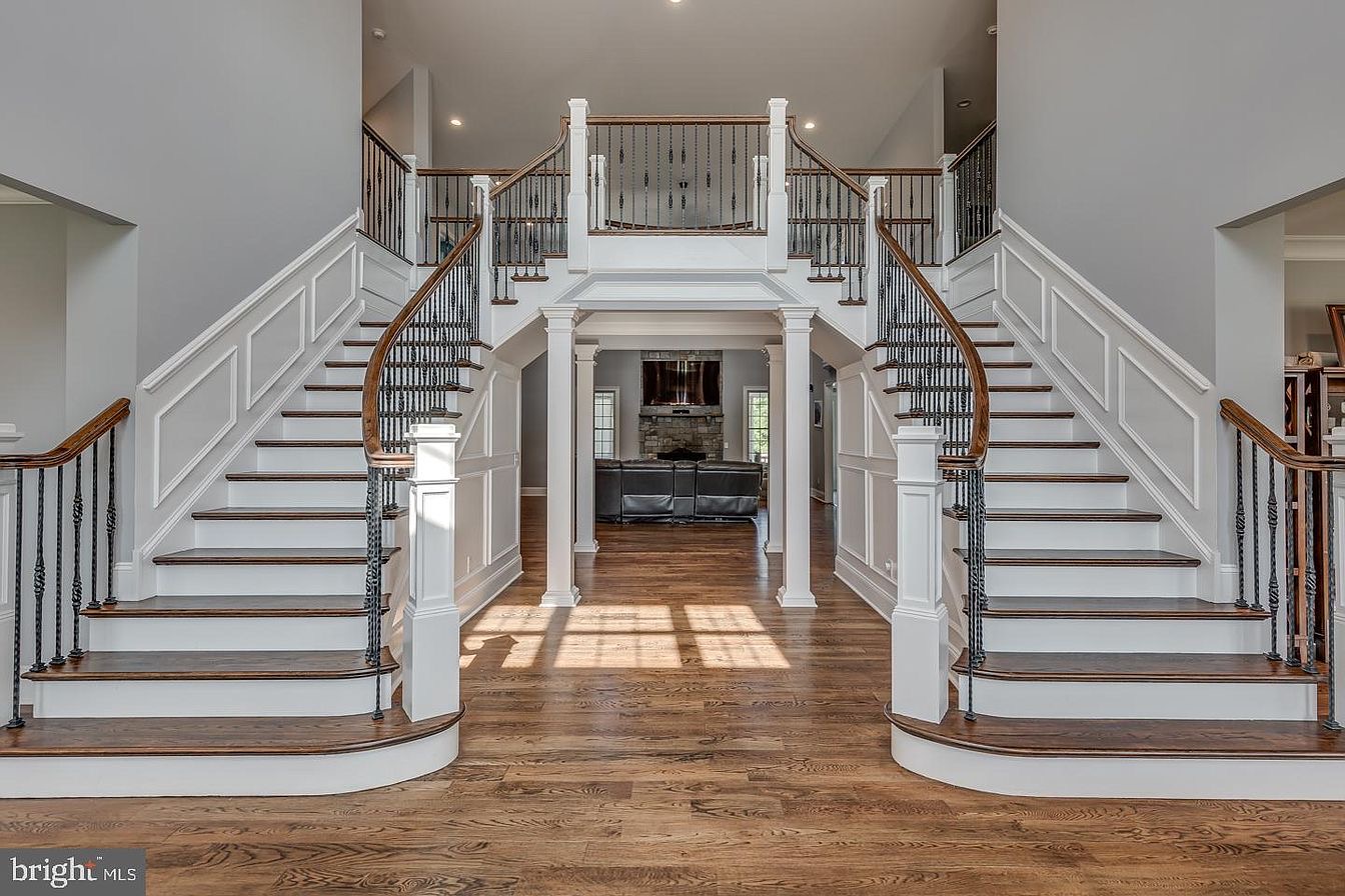 South Harrison Residence — symmetrical stair hall and second-floor bridge