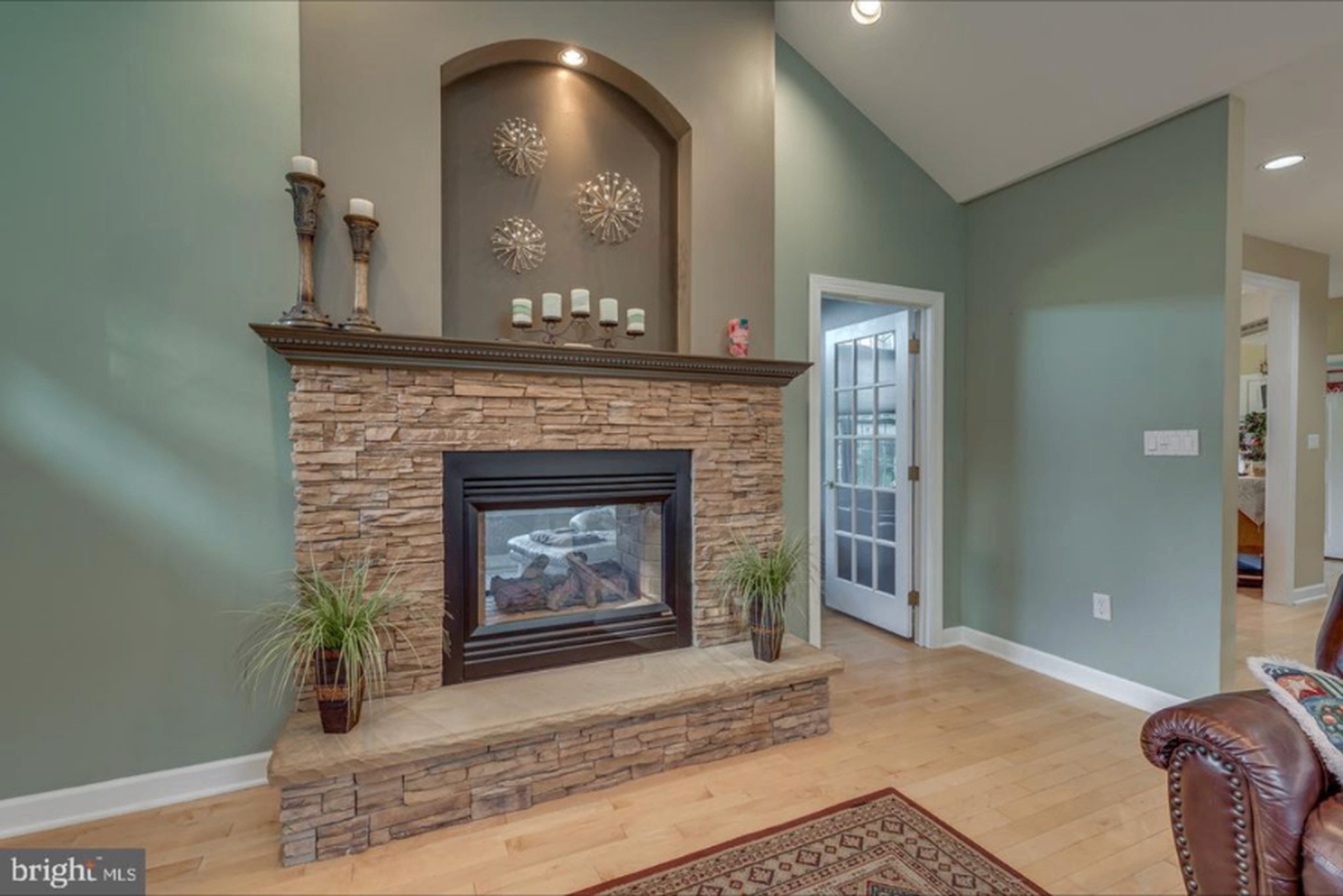 South Harrison Residence II — stone fireplace in the living room