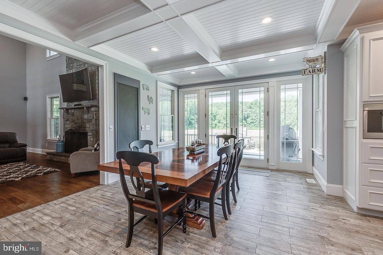 South Harrison Residence — dining area with coffered ceiling and terrace doors