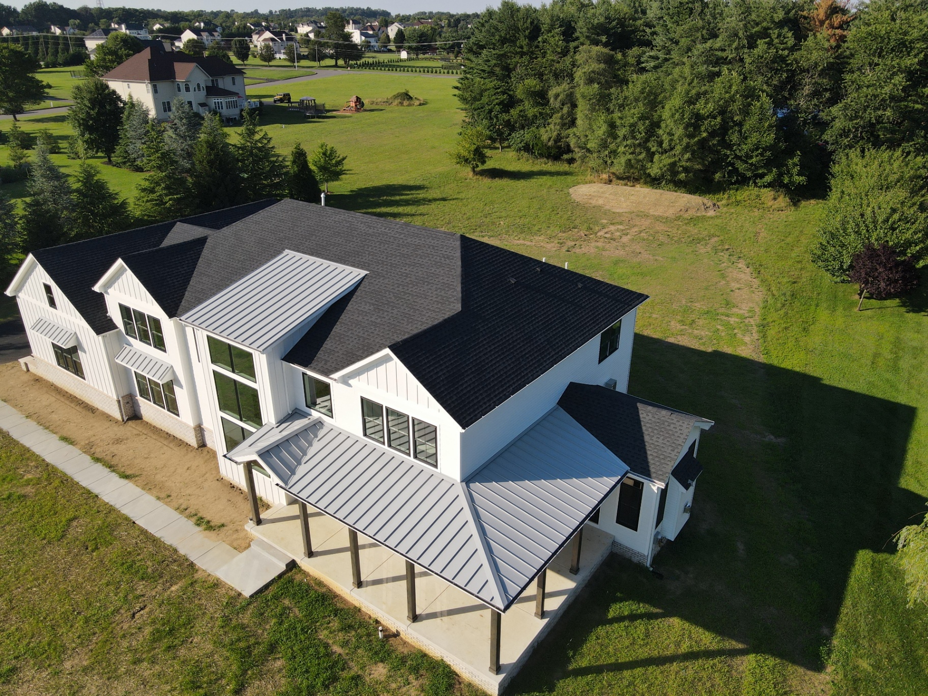 Swedesboro Residence — aerial view of the covered porch and metal roofing